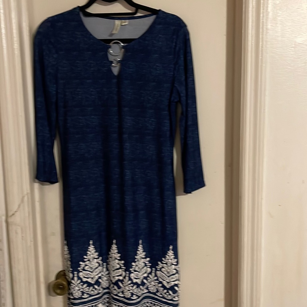 Tacera Blue woman’s dress size small with white border and has stretch.
